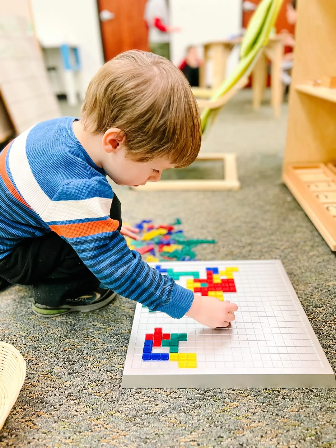 Child working with puzzle blocks