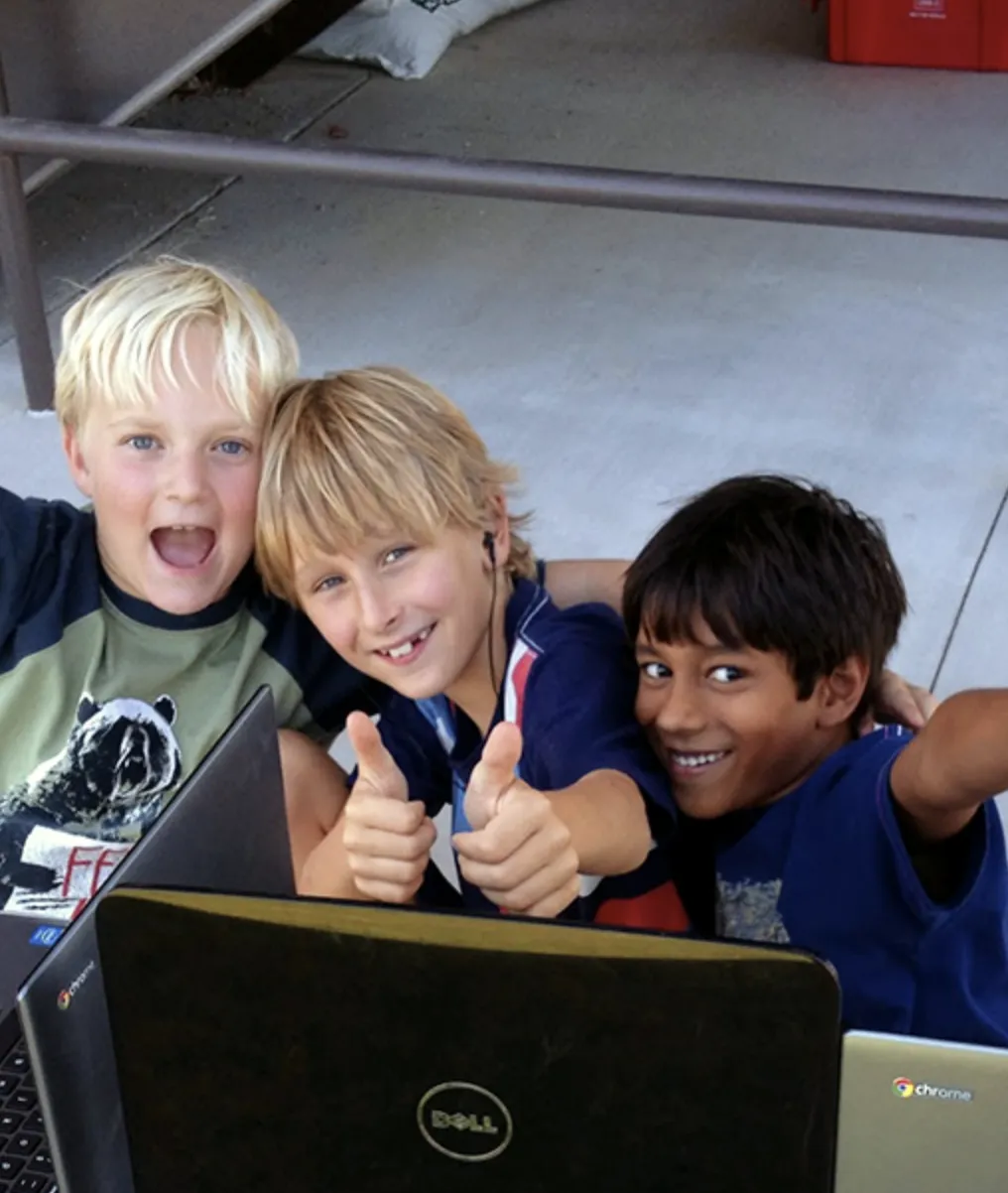 Children learning with laptops