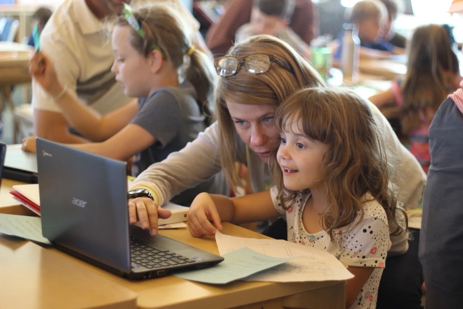 Girl and mom learning together